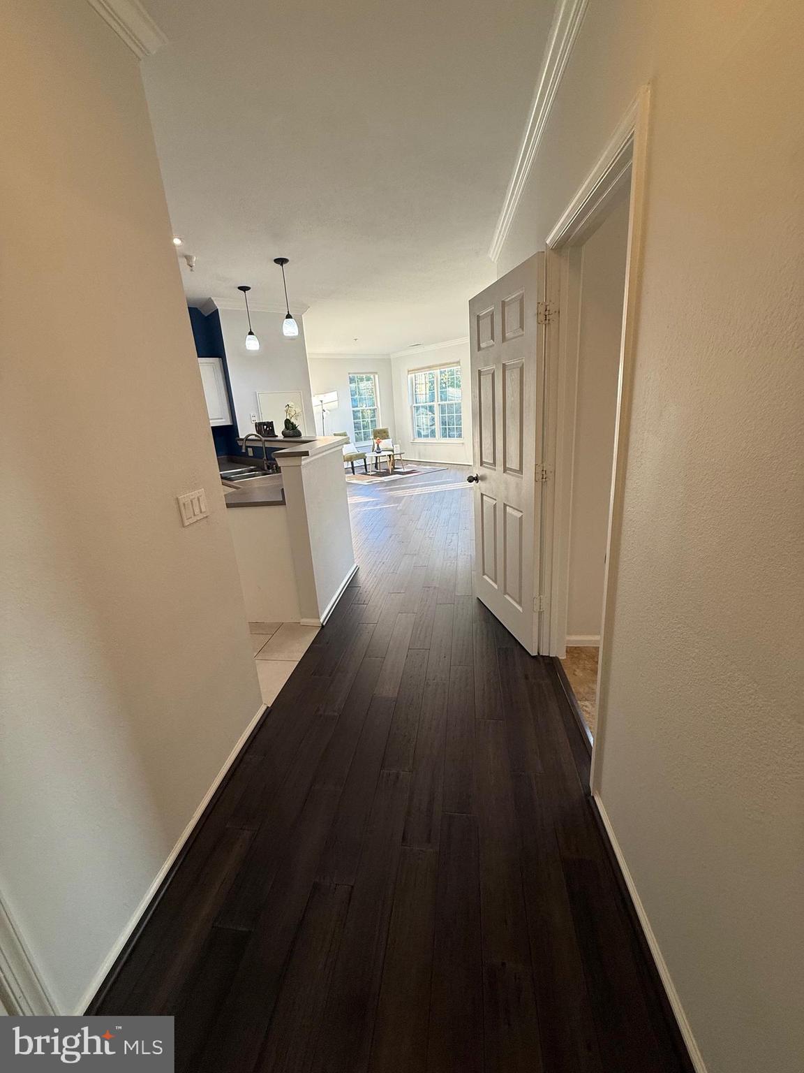 3009 Nicosh Circle, Unit 4302 Falls Church, VA 22042 - Photo 7 of 32 a view of a kitchen from a hallway