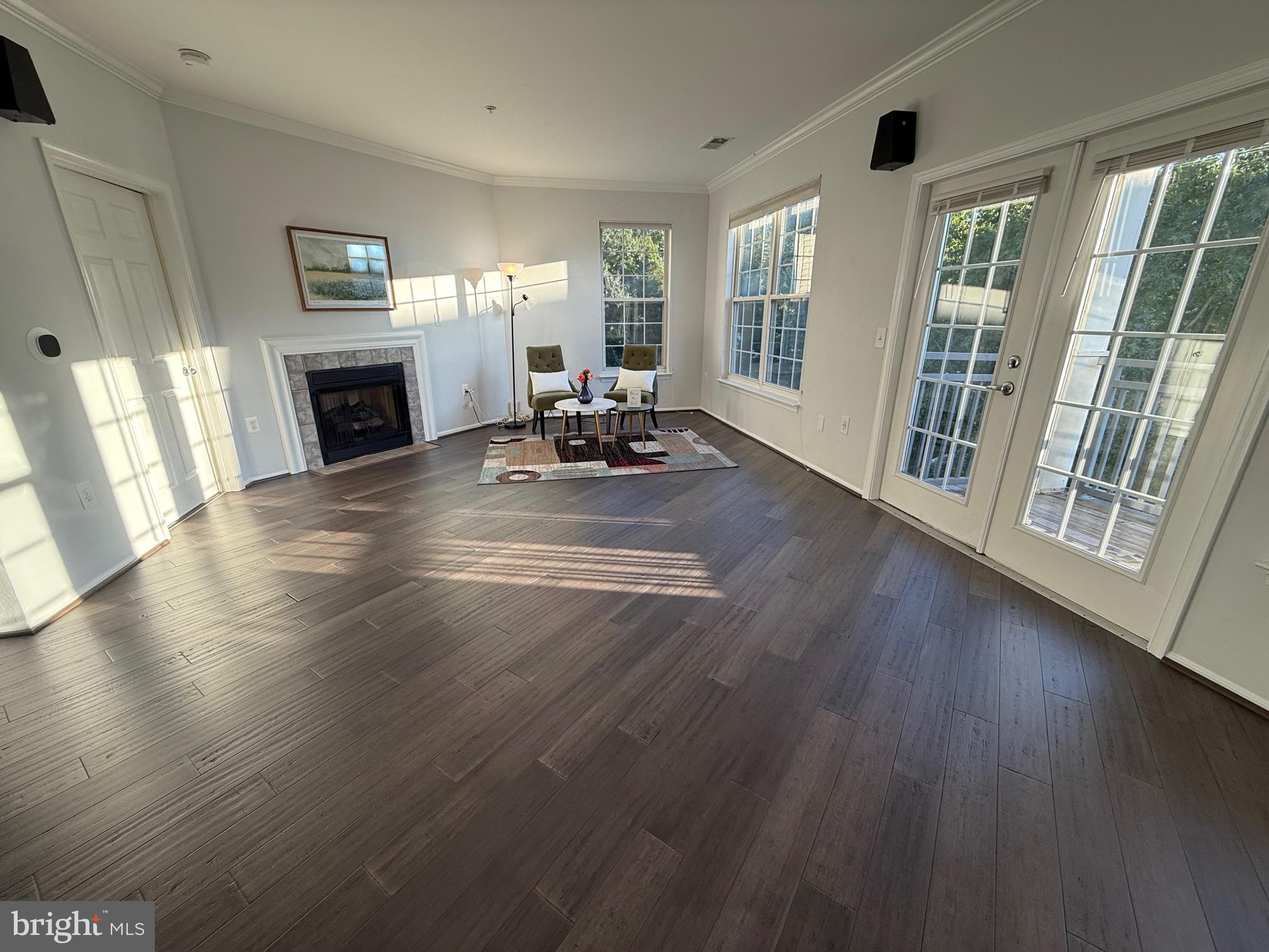 3009 Nicosh Circle, Unit 4302 Falls Church, VA 22042 - Photo 8 of 32 a view of a livingroom with furniture wooden floor and a window