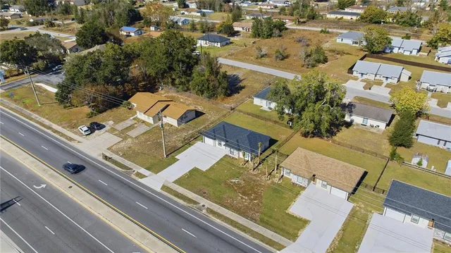 an aerial view of a residential apartment building with a lot of flower plants