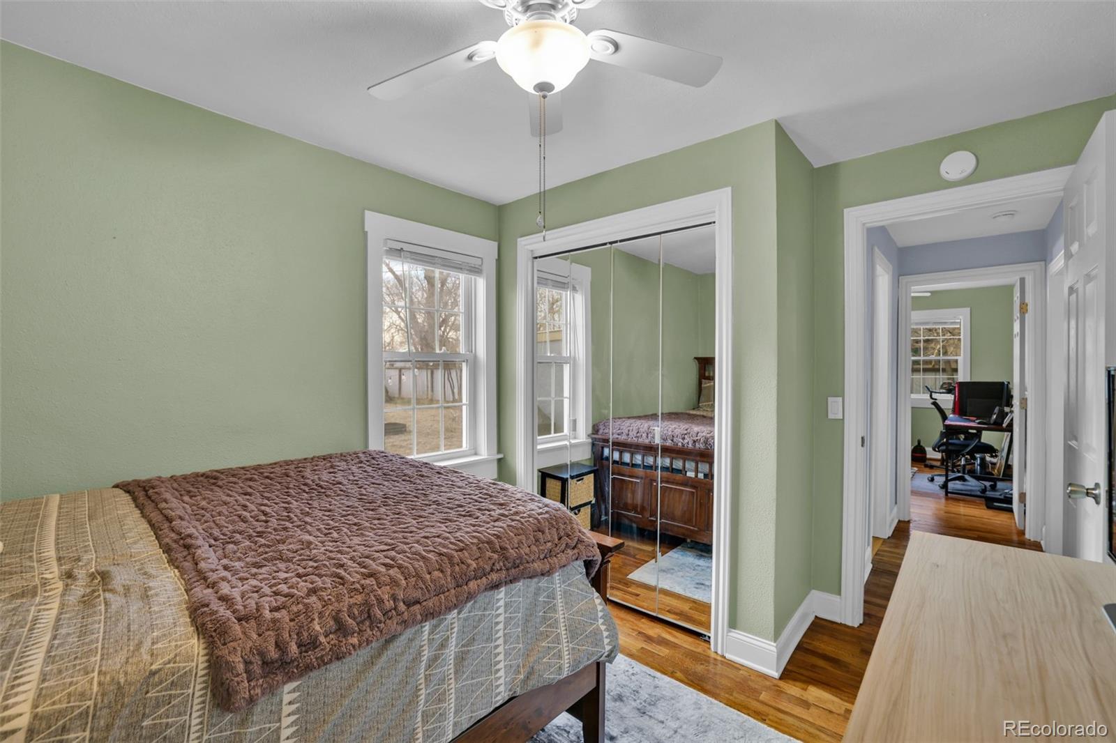 2411 Wyoming Avenue Pueblo, CO 81004 - Photo 14 of 25 a bedroom with a bed and a walk in closet