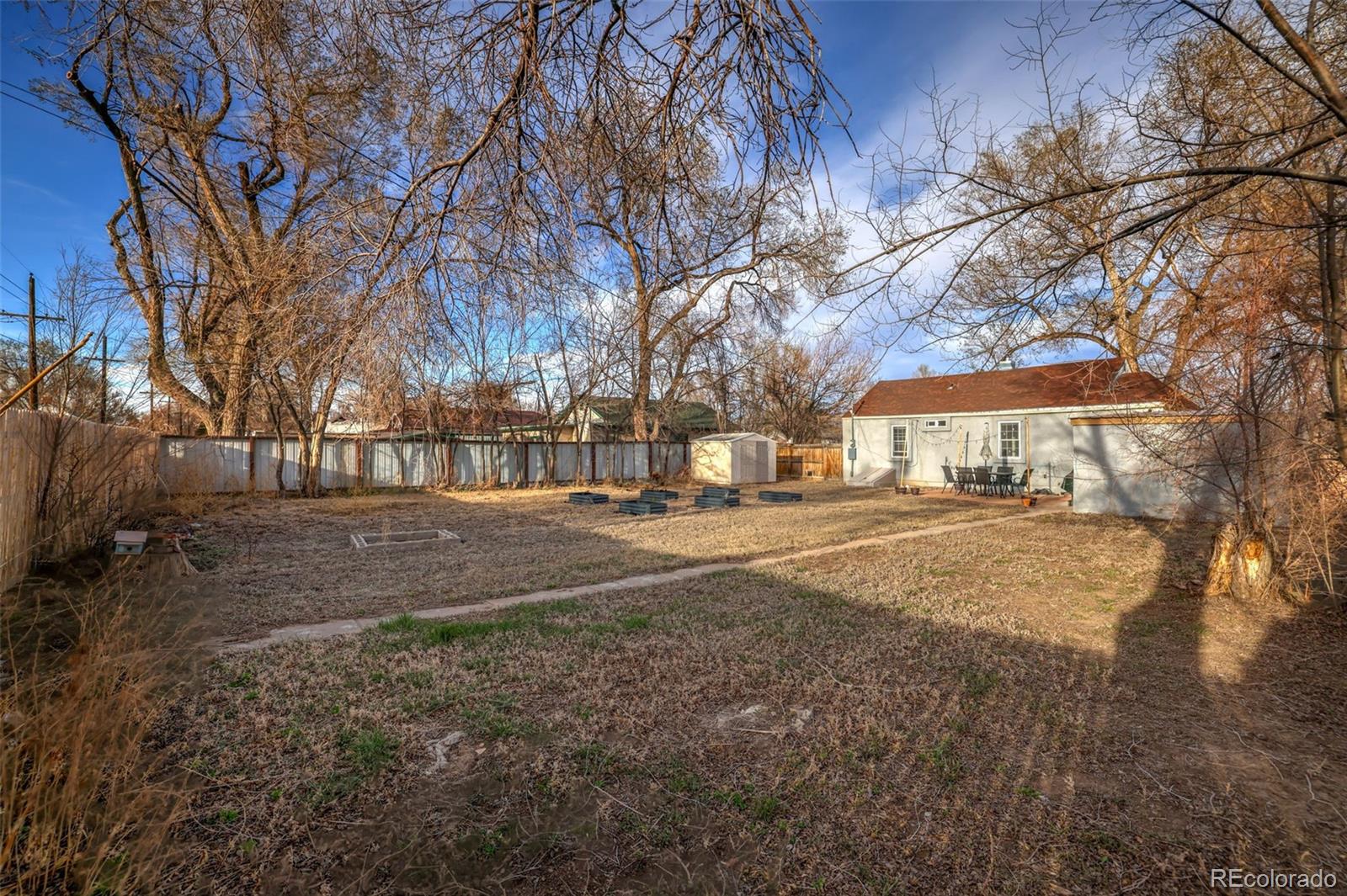 2411 Wyoming Avenue Pueblo, CO 81004 - Photo 20 of 25 a view of road with large trees
