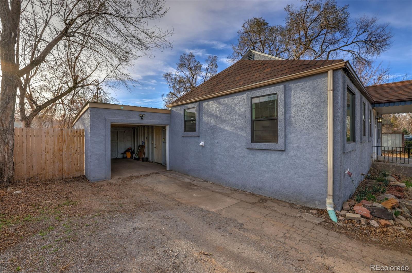 2411 Wyoming Avenue Pueblo, CO 81004 - Photo 22 of 25 a view of a house with a large tree