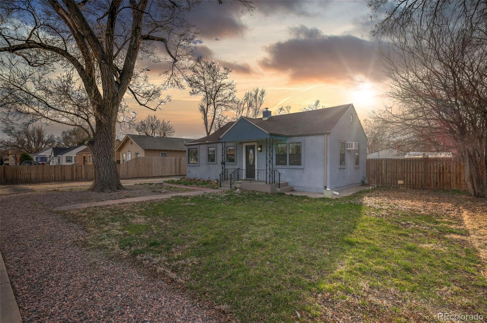 2411 Wyoming Avenue Pueblo, CO 81004 - Photo 23 of 25 a view of a house with backyard and a tree