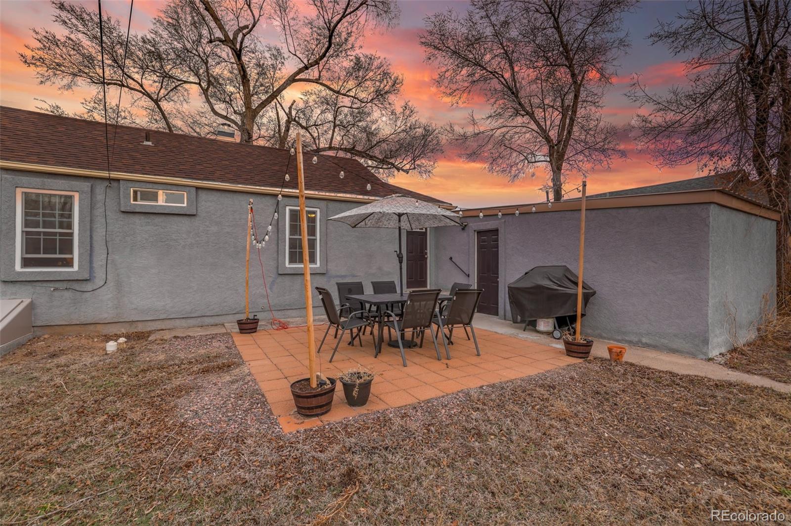 2411 Wyoming Avenue Pueblo, CO 81004 - Photo 24 of 25 a backyard of a house with table and chairs