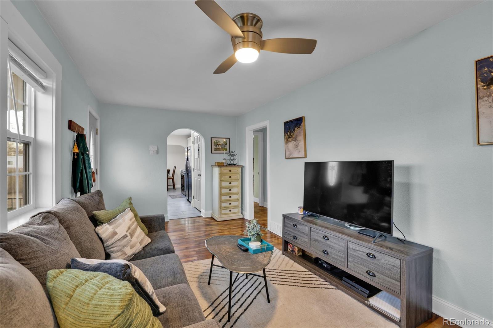 2411 Wyoming Avenue Pueblo, CO 81004 - Photo 7 of 25 a living room with furniture and a flat screen tv
