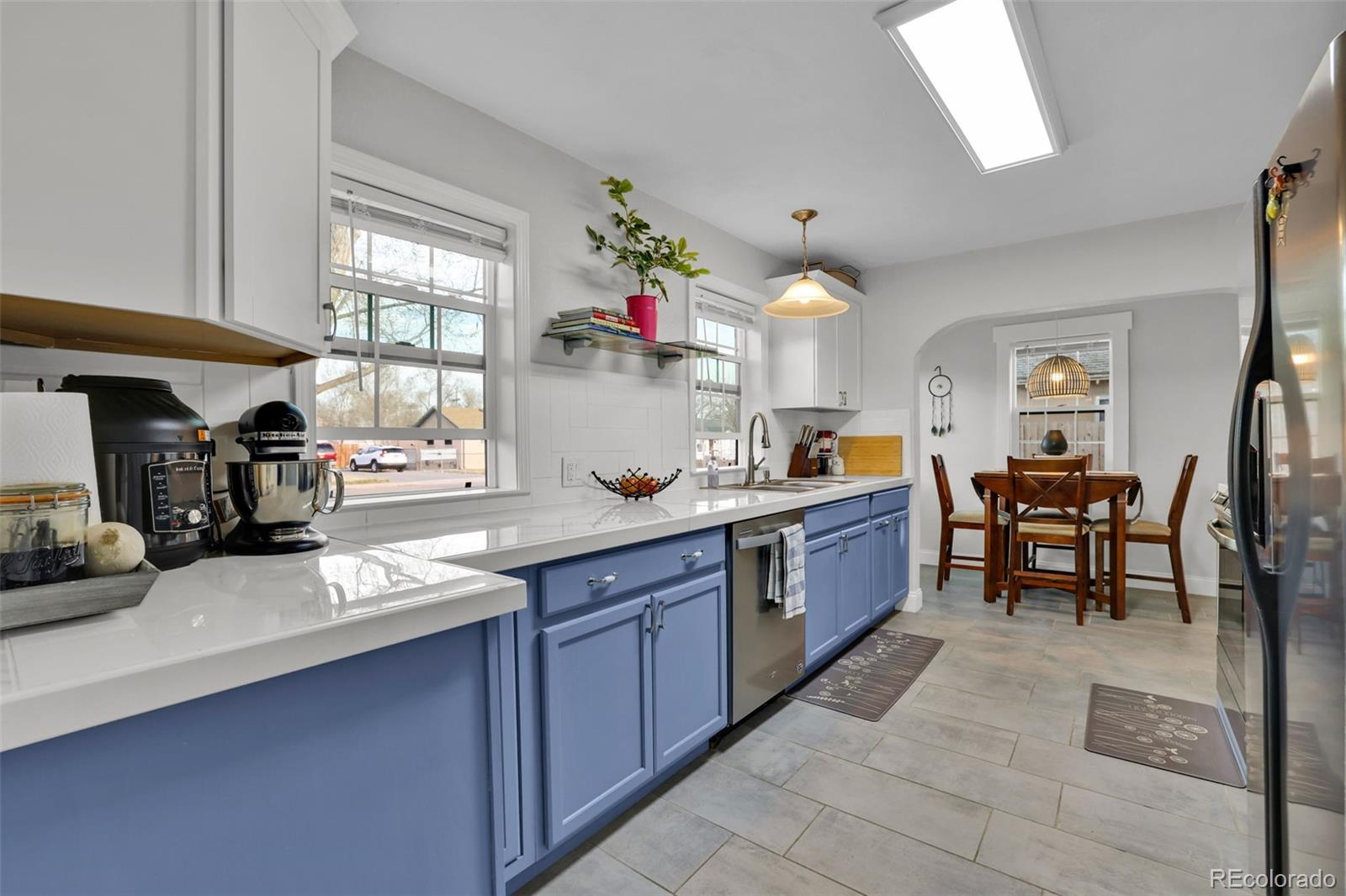 2411 Wyoming Avenue Pueblo, CO 81004 - Photo 8 of 25 a large kitchen with lots of counter space and breakfast area