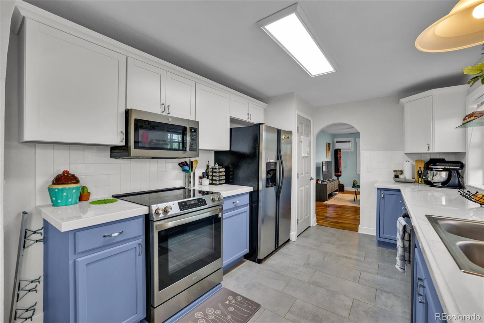 2411 Wyoming Avenue Pueblo, CO 81004 - Photo 9 of 25 a kitchen with kitchen island granite countertop stainless steel appliances and sink