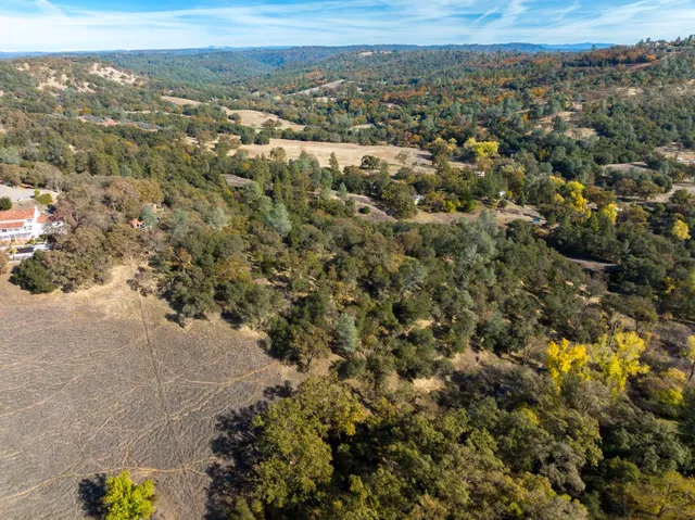 an aerial view of house with yard