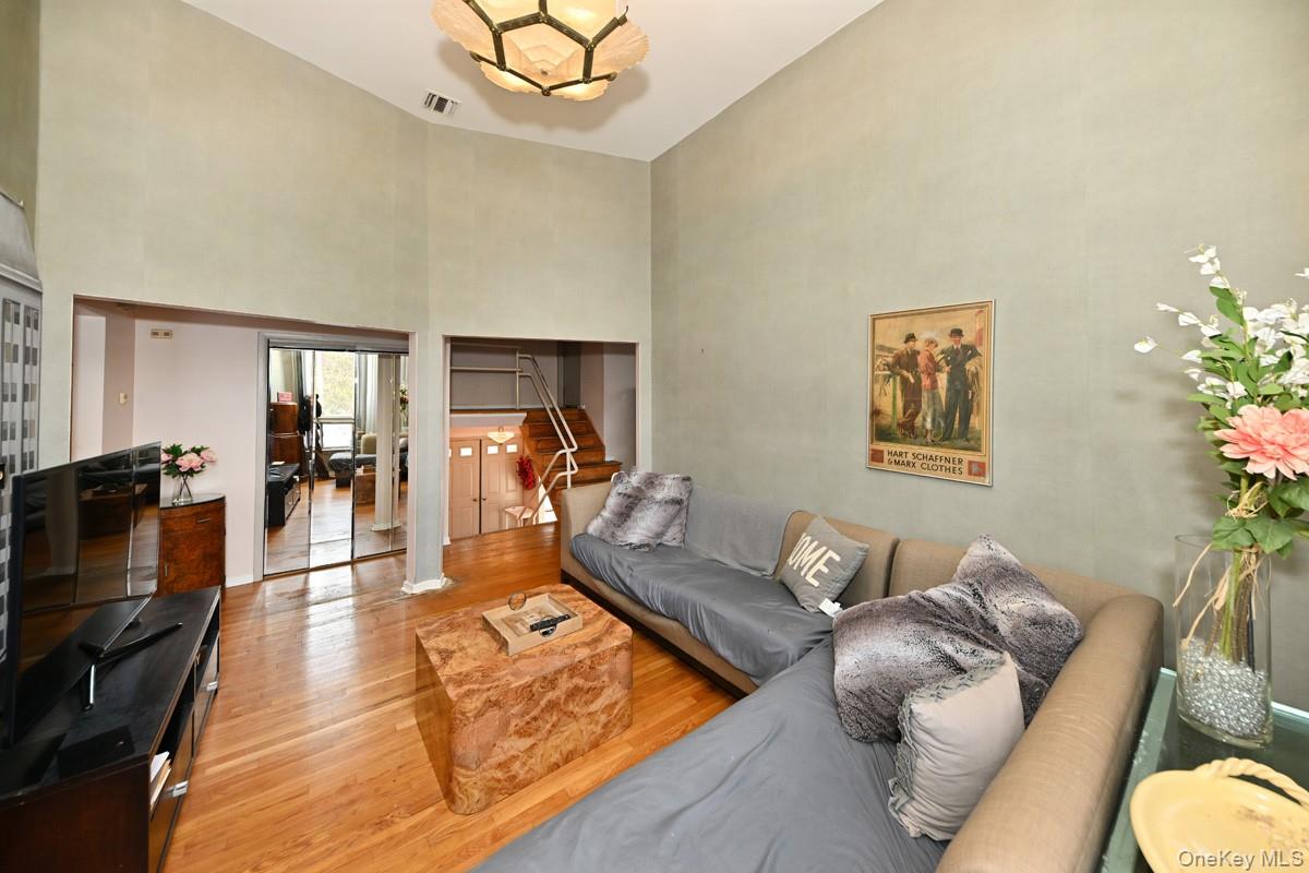 11 Lomond Avenue Chestnut Ridge, NY 10977 - Photo 13 of 26 Living area featuring a towering ceiling and wood finished floors