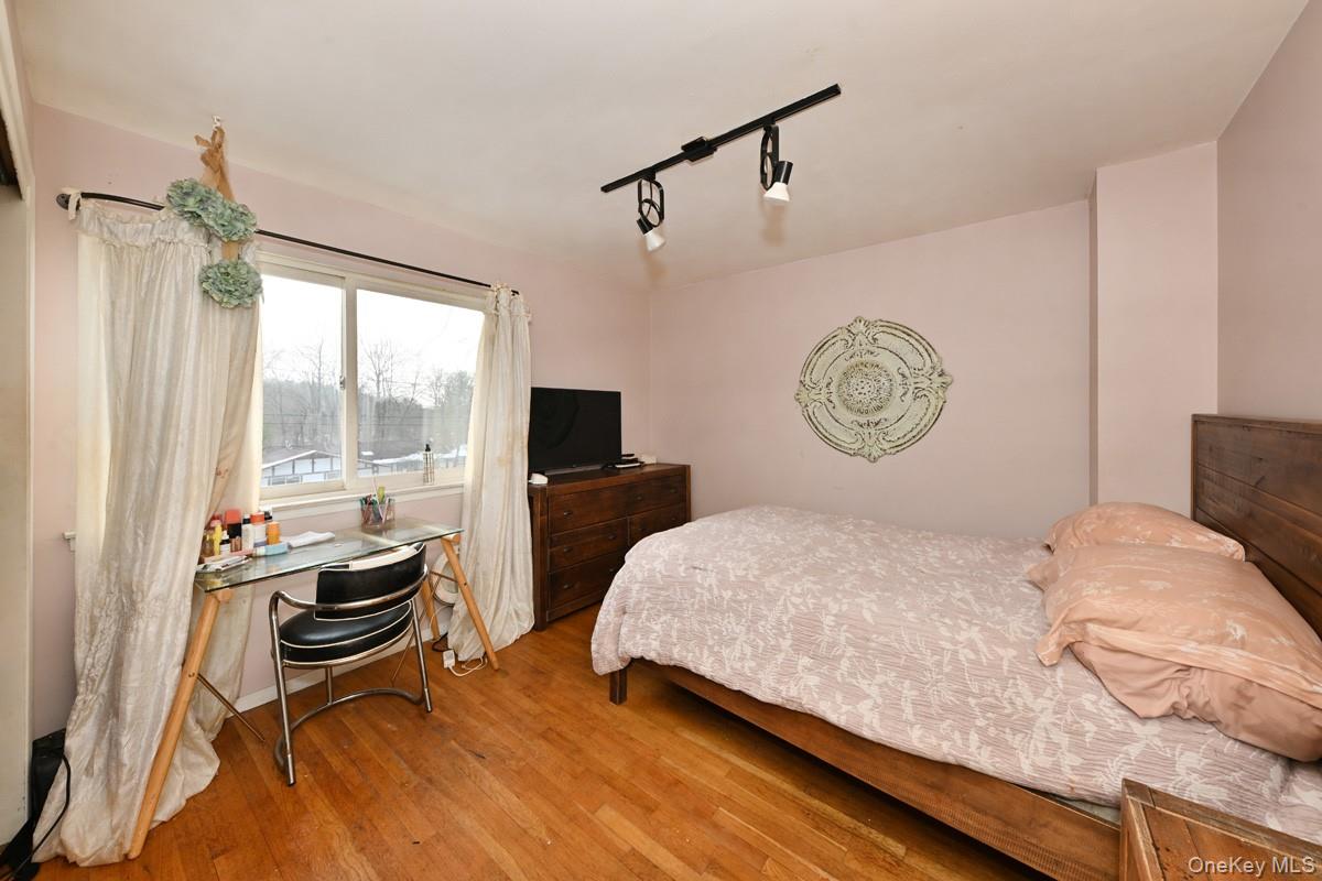 11 Lomond Avenue Chestnut Ridge, NY 10977 - Photo 17 of 26 Bedroom with rail lighting and wood-type flooring