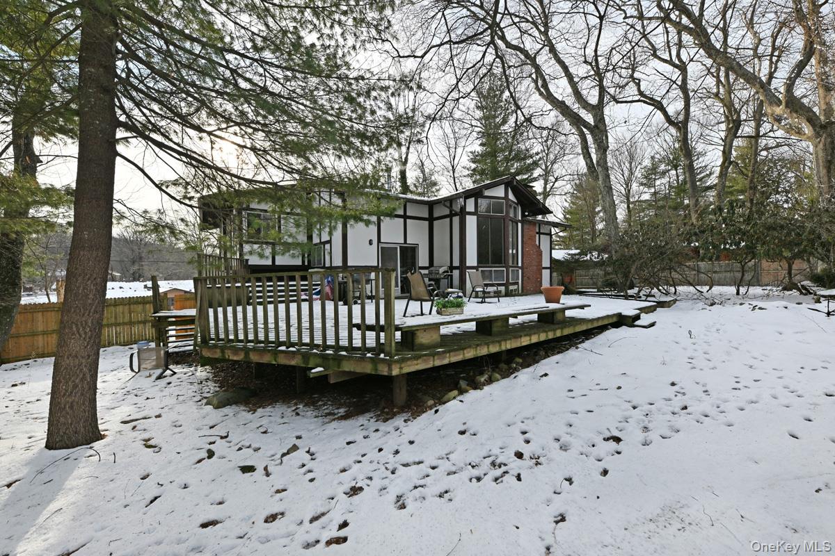 11 Lomond Avenue Chestnut Ridge, NY 10977 - Photo 26 of 26 Snow covered back of property featuring a wooden deck and stucco siding