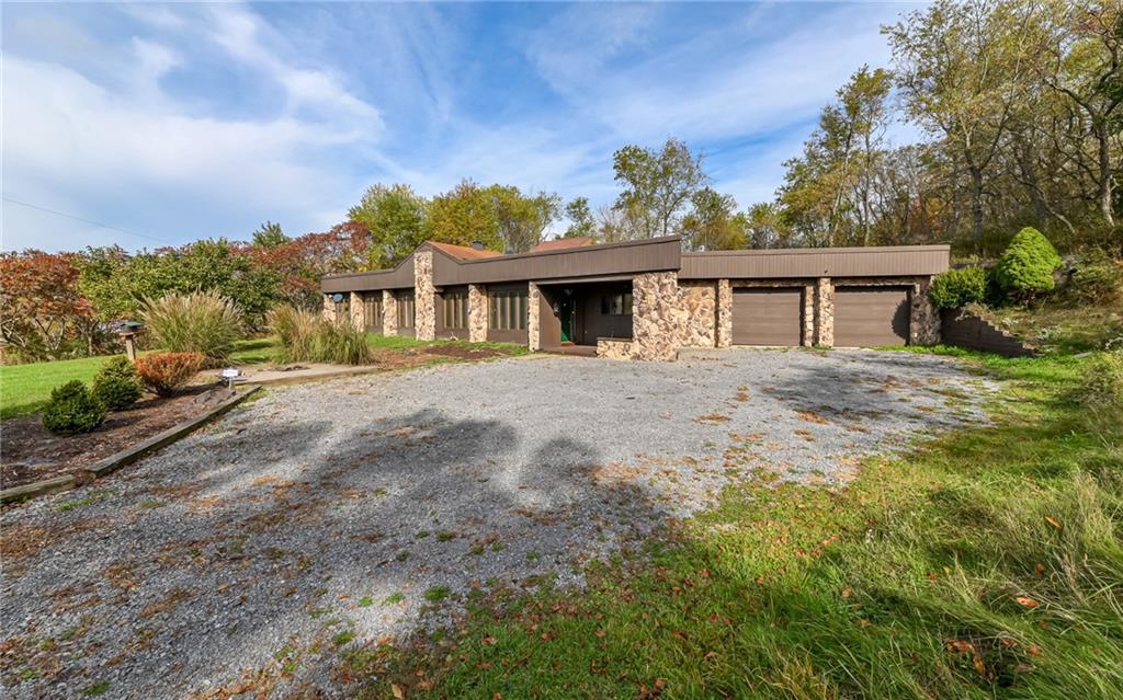 3656 Graham School Road Cranberry Township, PA 16066 - Photo 21 of 28 a front view of a house with a yard and trees