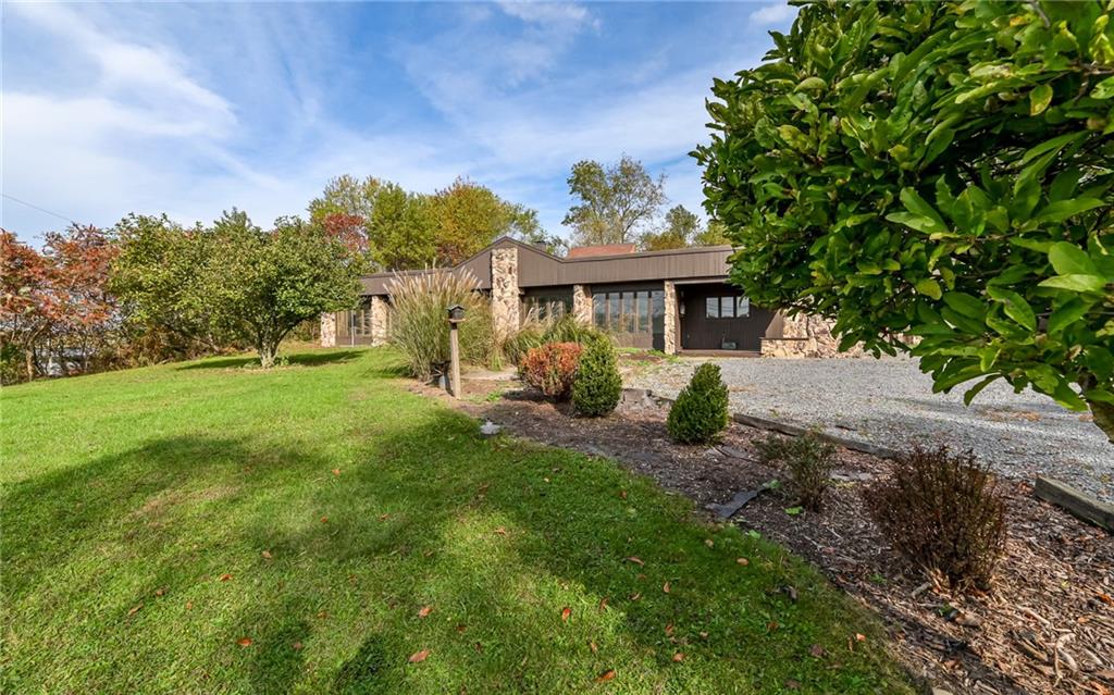 3656 Graham School Road Cranberry Township, PA 16066 - Photo 22 of 28 a view of a house with backyard sitting area and garden
