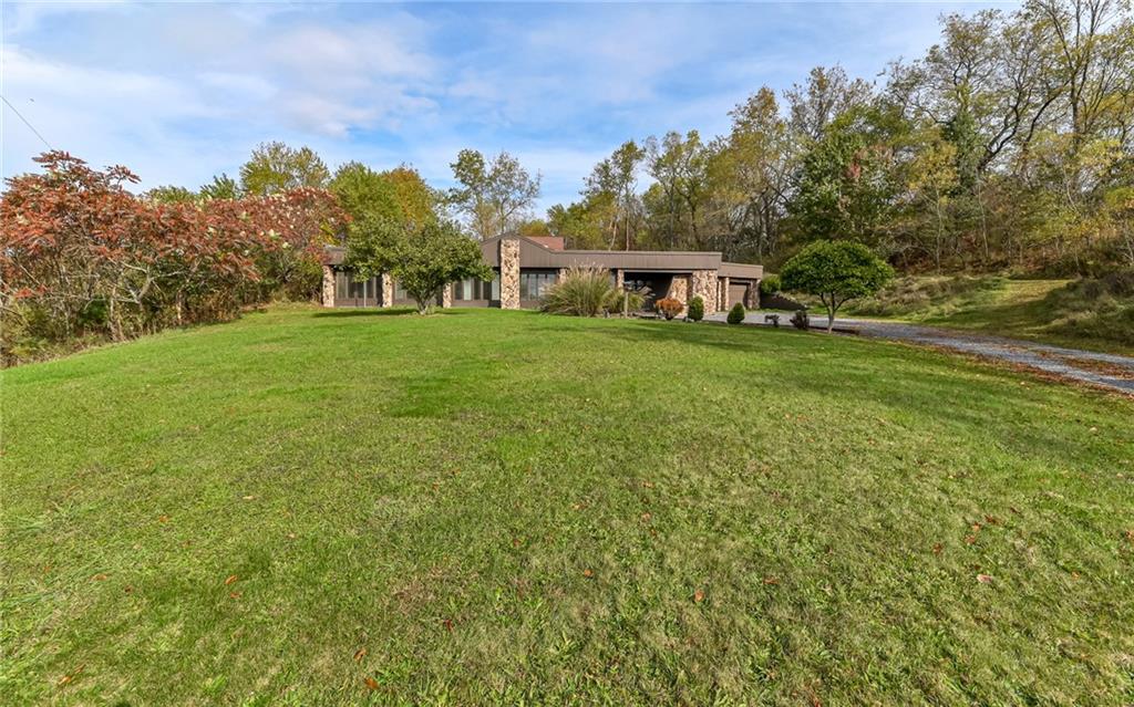 3656 Graham School Road Cranberry Township, PA 16066 - Photo 27 of 28 a front view of a house with a yard and trees