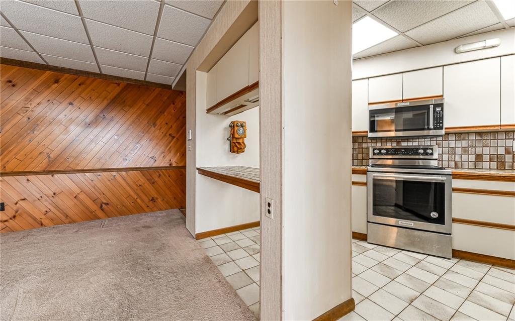 3656 Graham School Road Cranberry Township, PA 16066 - Photo 9 of 28 a view of kitchen stove microwave and cabinets