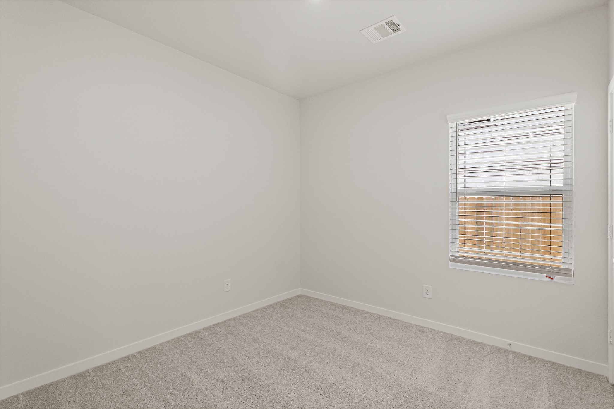 17207 King Eider Road Waller, TX 77484 - Photo 5 of 33 an empty room with a window