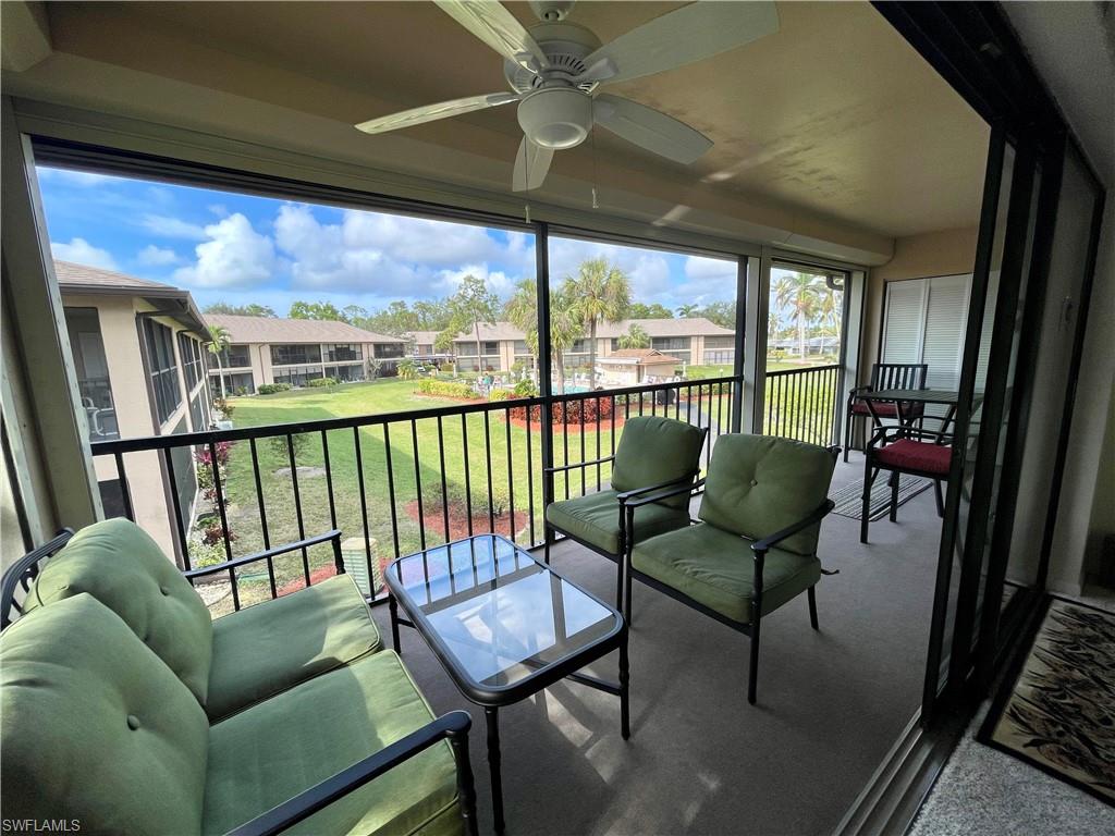 256 Pebble Beach Circle, Unit D201 Naples, FL 34113 - Photo 16 of 19 a view of a chairs in balcony