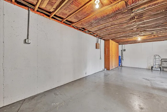 a view of a room with wooden walls