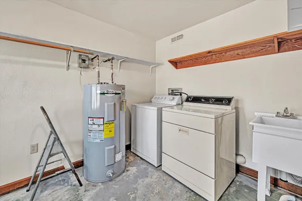 a bathroom with a sink mirror and toilet