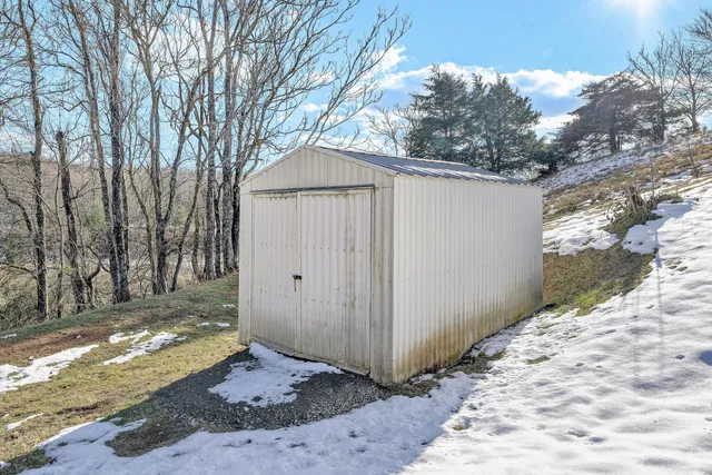 a picture of a room with a white wall and door