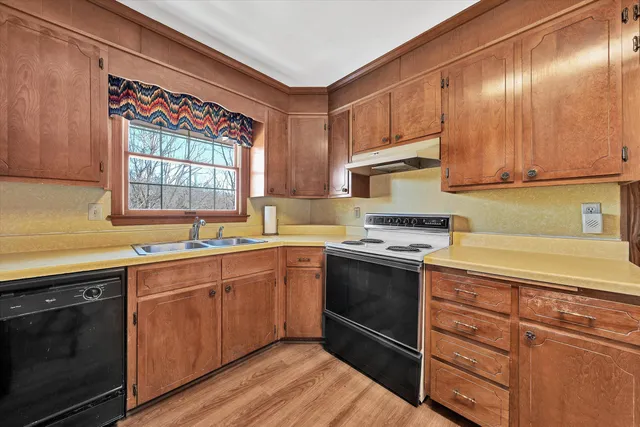 a room with a bed and furniture