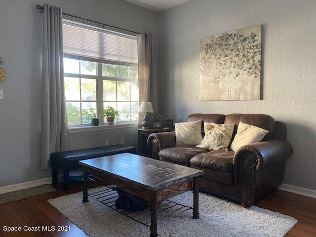 105 Turpial Way, Unit 105 Melbourne, FL 32901 - Photo 16 of 25 a living room with furniture and a window