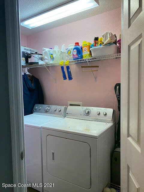 105 Turpial Way, Unit 105 Melbourne, FL 32901 - Photo 18 of 25 a utility room with dryer and washer