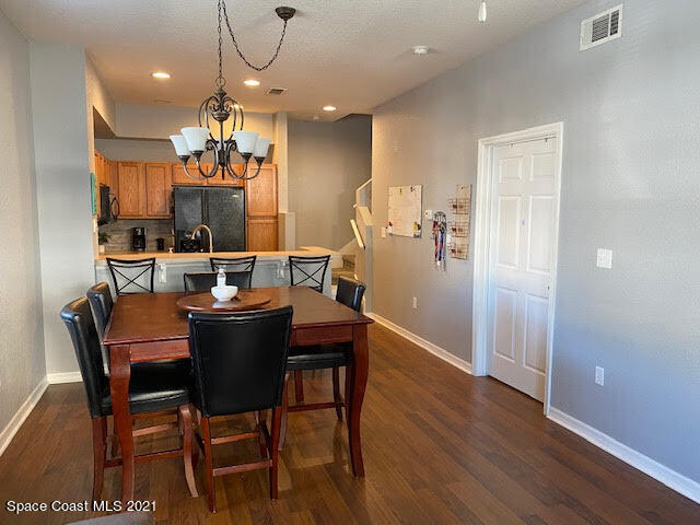 105 Turpial Way, Unit 105 Melbourne, FL 32901 - Photo 4 of 25 a view of a dining room with furniture
