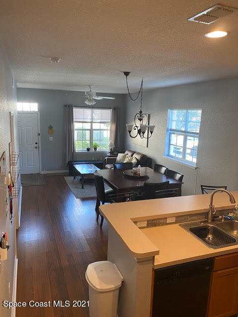 105 Turpial Way, Unit 105 Melbourne, FL 32901 - Photo 9 of 25 a kitchen with a sink stove and cabinets
