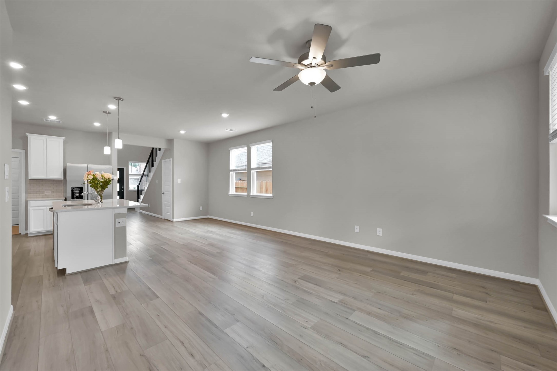 213 Harper Ridge Drive Montgomery, TX 77316 - Photo 13 of 34 a view of an empty room with kitchen and window