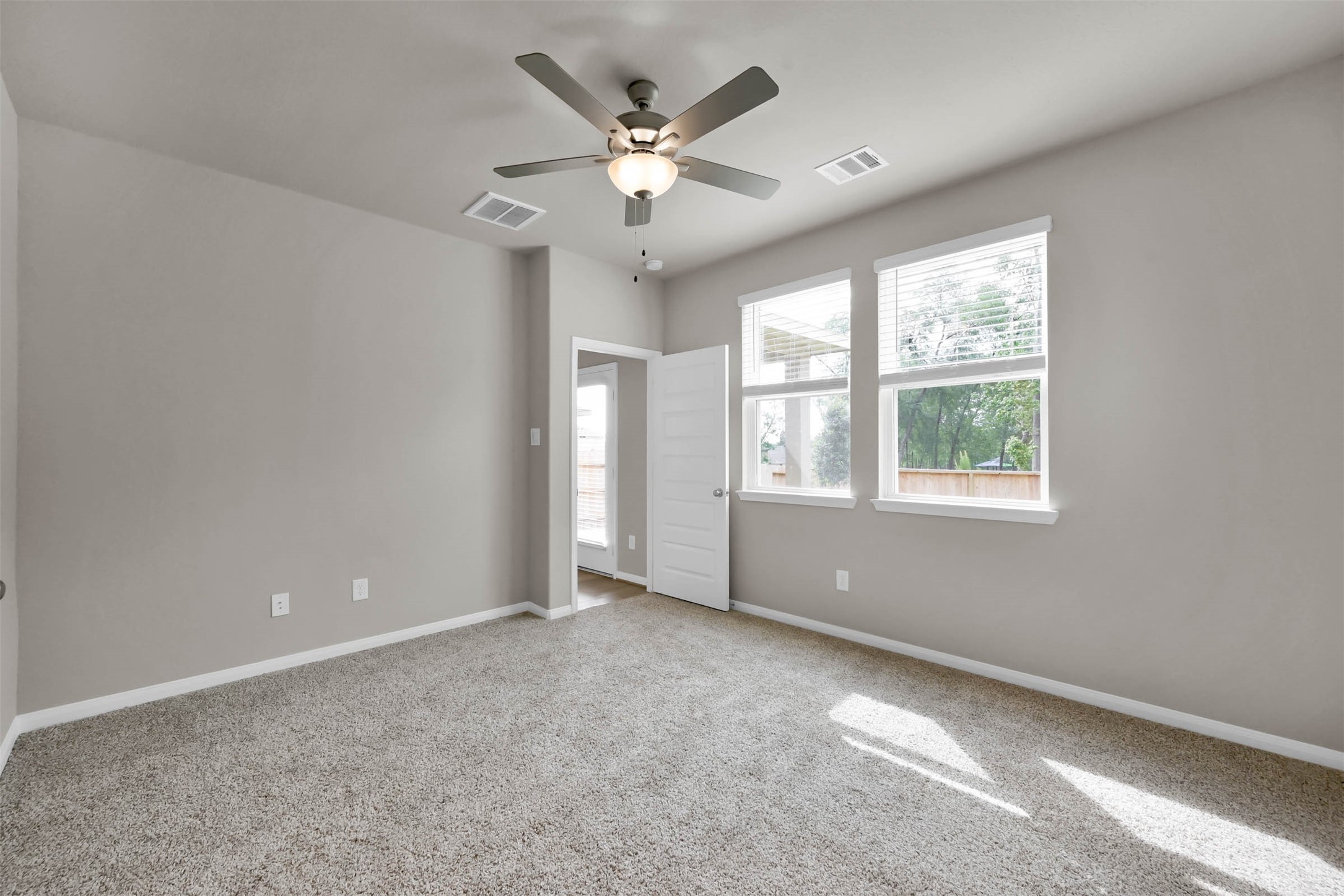 213 Harper Ridge Drive Montgomery, TX 77316 - Photo 17 of 34 a view of an empty room with a window