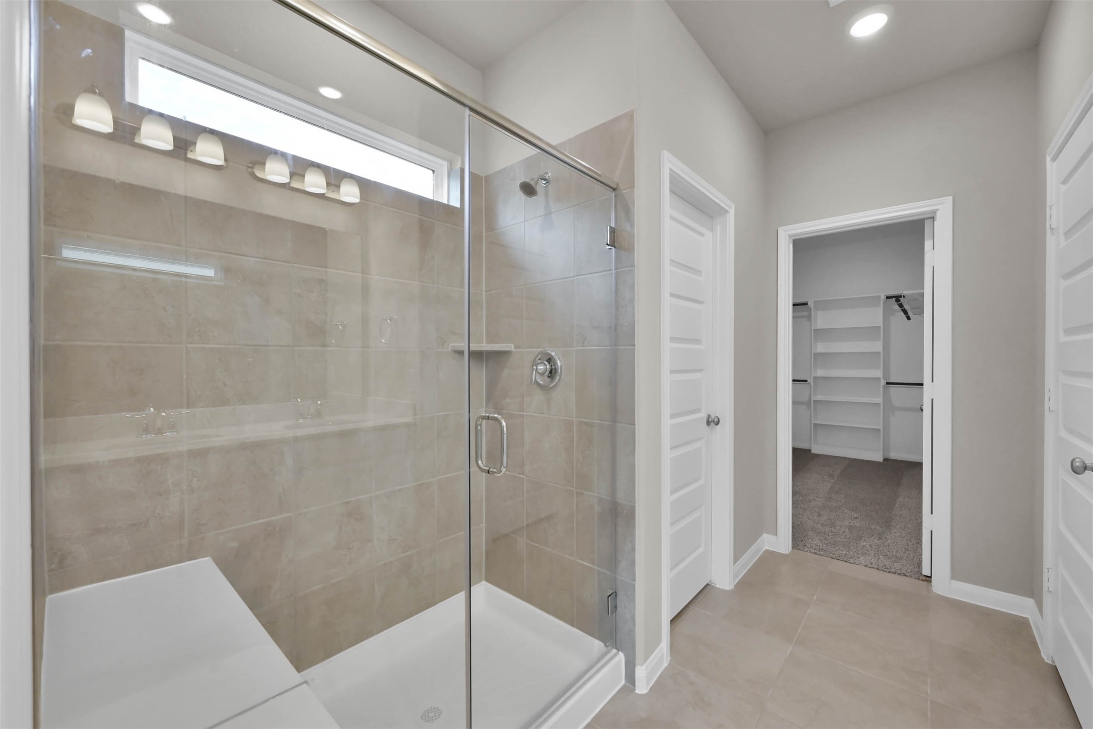 213 Harper Ridge Drive Montgomery, TX 77316 - Photo 19 of 34 a bathroom with a shower and a glass door