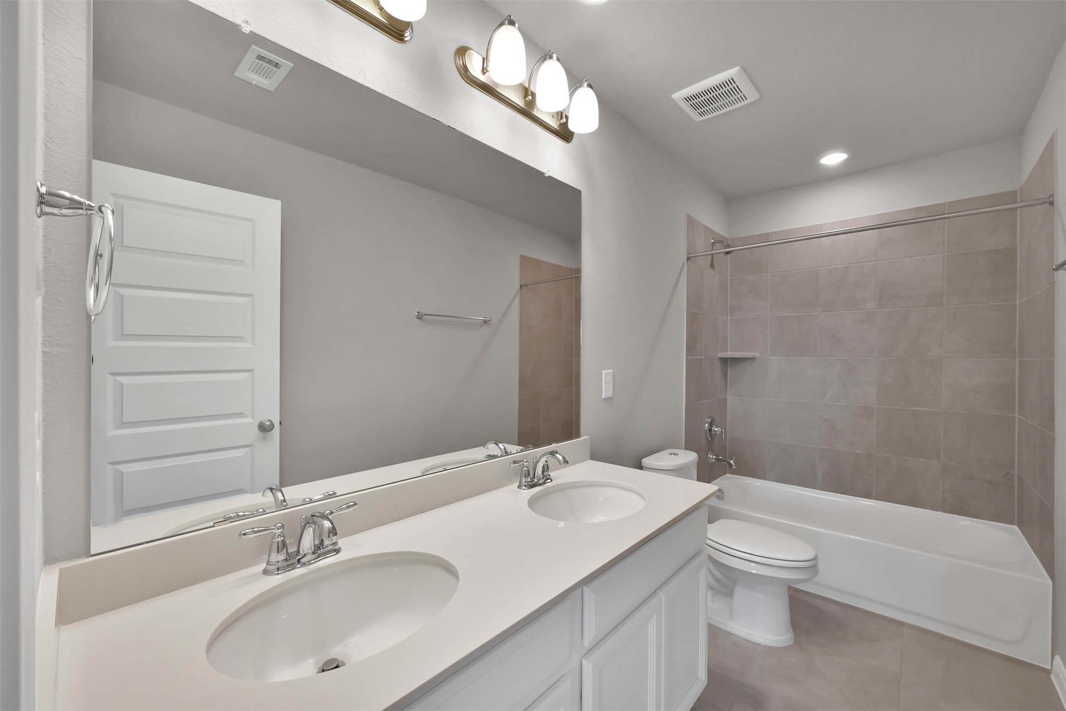 213 Harper Ridge Drive Montgomery, TX 77316 - Photo 22 of 34 a bathroom with a sink a toilet and a mirror
