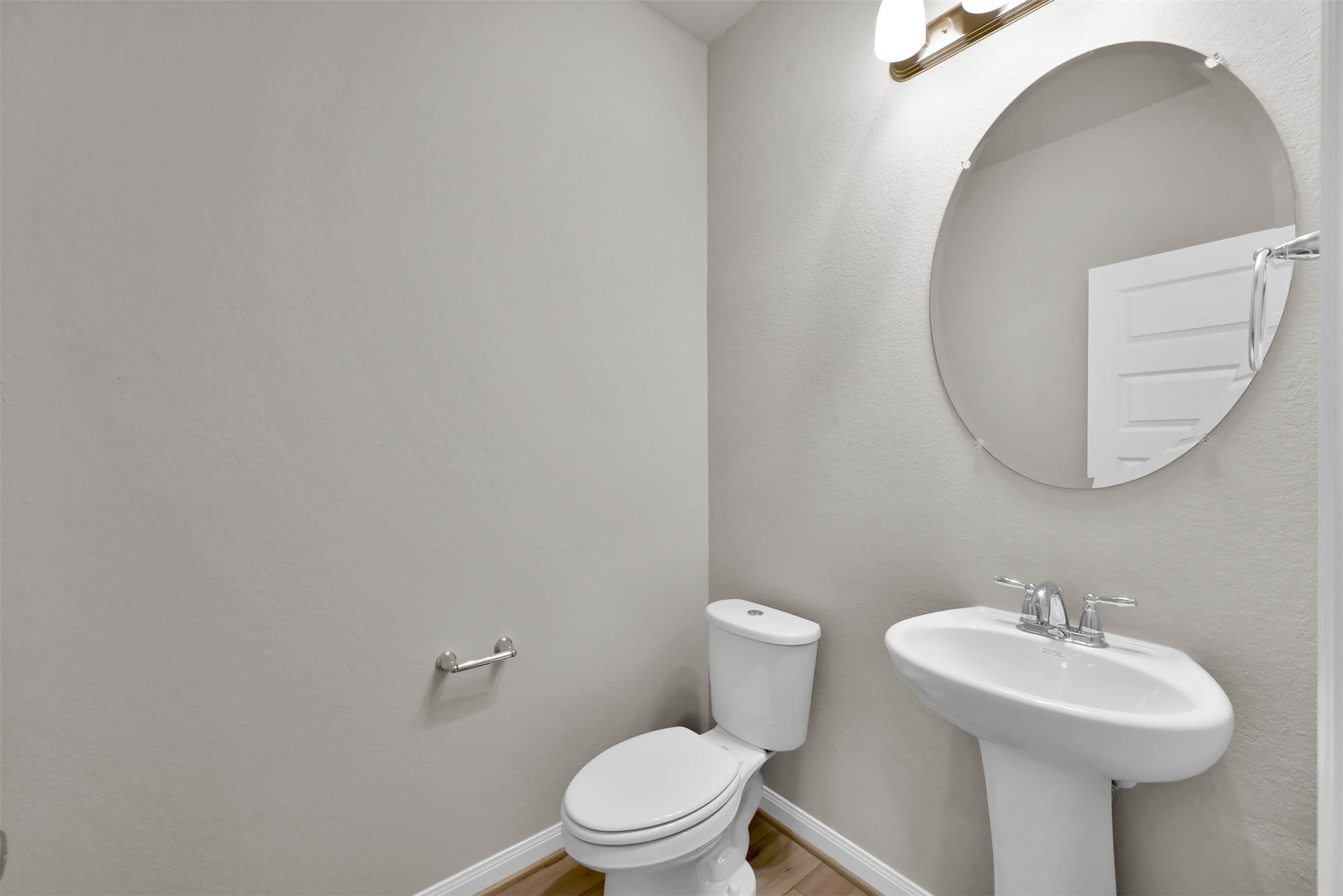 213 Harper Ridge Drive Montgomery, TX 77316 - Photo 28 of 34 a bathroom with a sink a mirror and a toilet