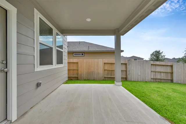 a view of a back yard of the house