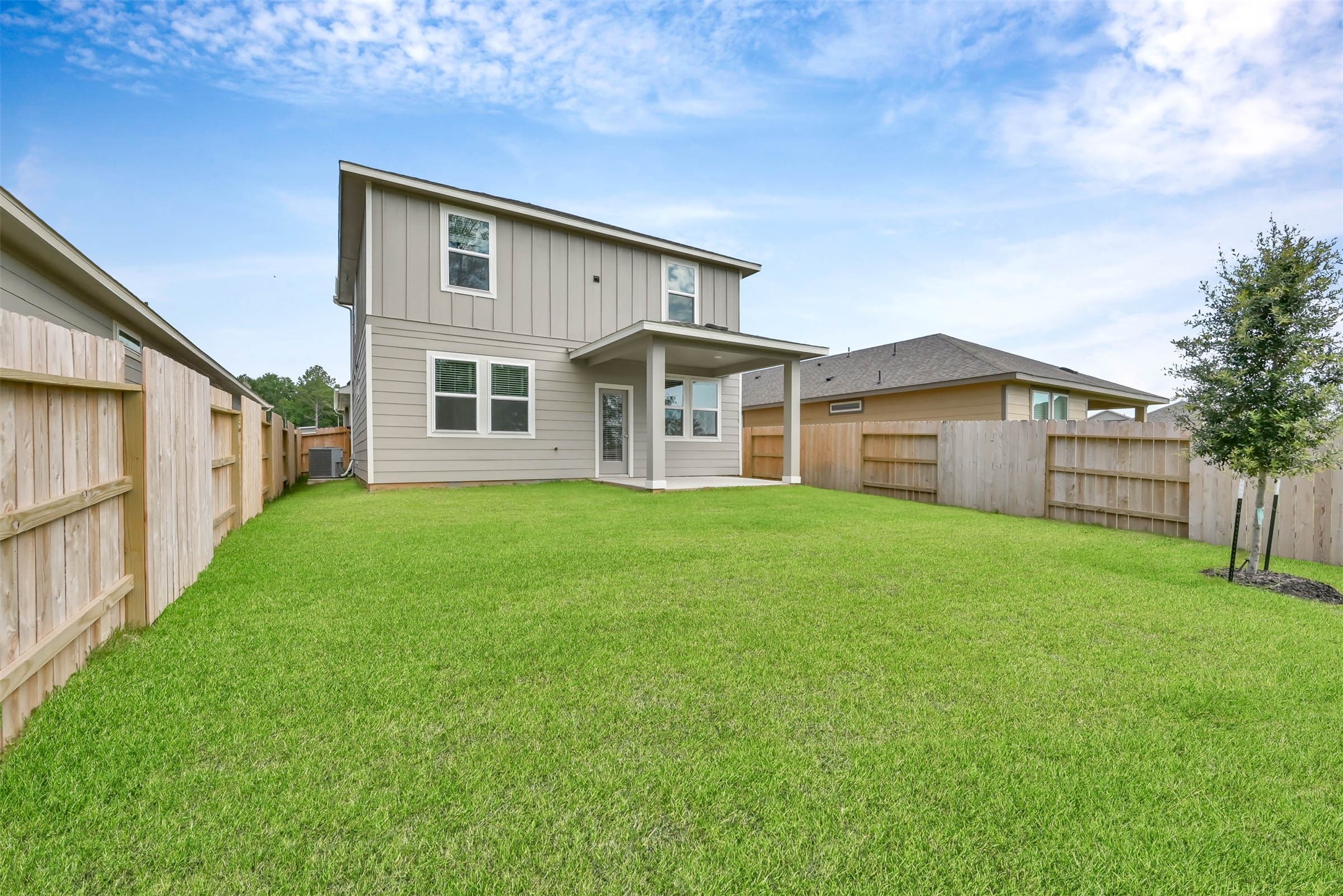 213 Harper Ridge Drive Montgomery, TX 77316 - Photo 33 of 34 a front view of a house with a garden and yard