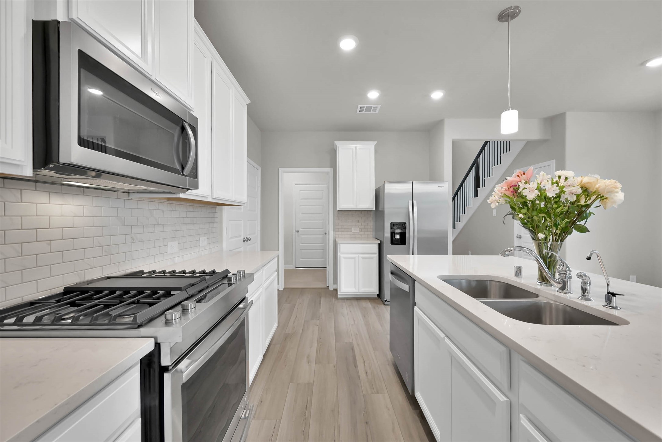 213 Harper Ridge Drive Montgomery, TX 77316 - Photo 8 of 34 a kitchen with a sink and steel appliances