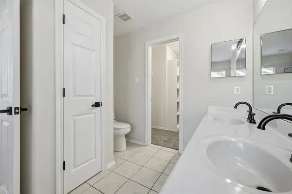a bathroom with a sink and toilet