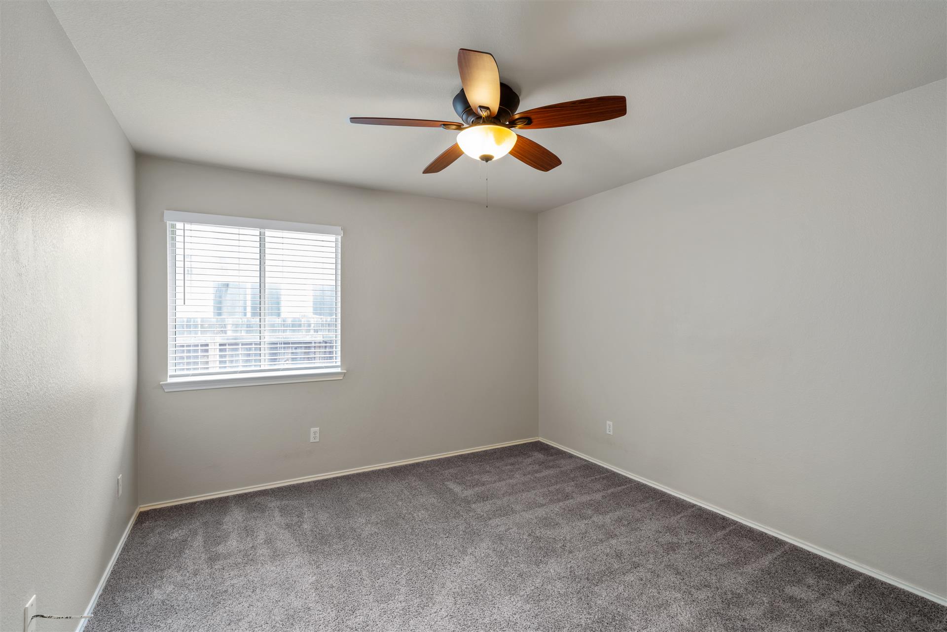 4725 Tello Path Austin, TX 78749 - Photo 26 of 34 Well-lit sleeping quarters with a ceiling fan for comfort.