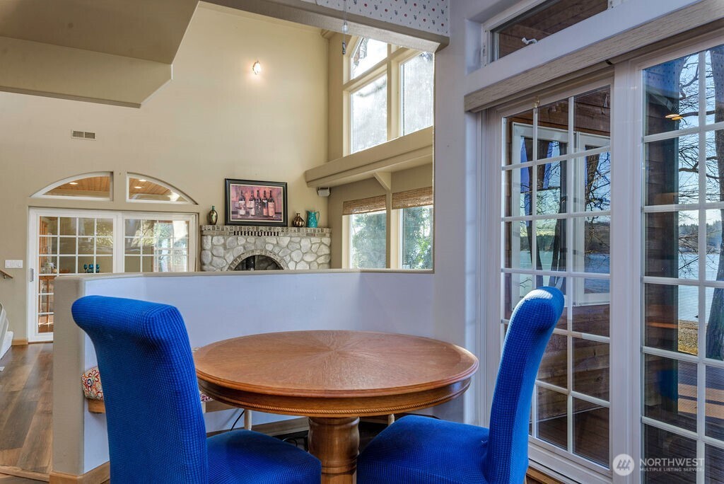 3250 Highway 302 Belfair, WA 98528 - Photo 13 of 40 a view of a dining room with furniture window and wooden floor