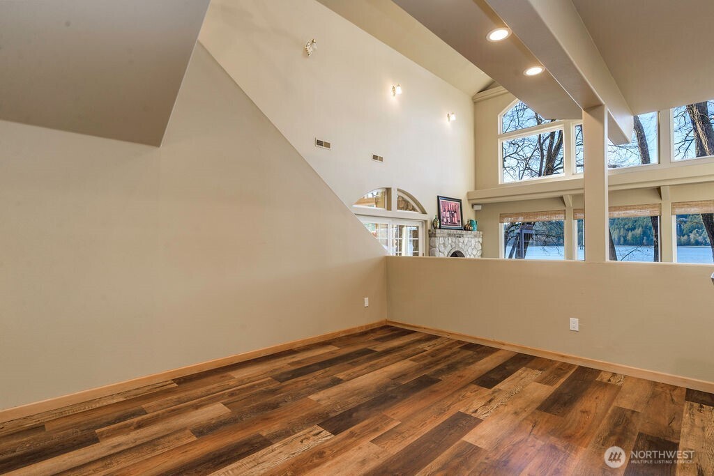 3250 Highway 302 Belfair, WA 98528 - Photo 14 of 40 a view of a room with wooden floor and staircase