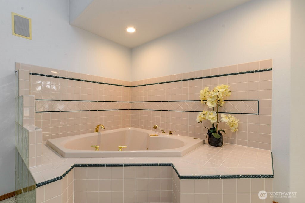 3250 Highway 302 Belfair, WA 98528 - Photo 21 of 40 a bathroom with a sink and mirror