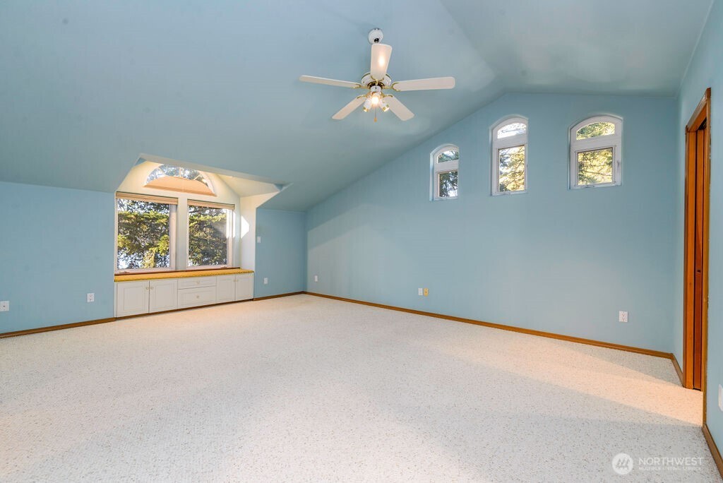 3250 Highway 302 Belfair, WA 98528 - Photo 22 of 40 an empty room with windows and fan