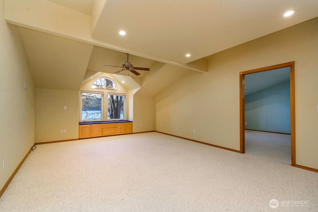 3250 Highway 302 Belfair, WA 98528 - Photo 24 of 40 an empty room with windows and fireplace