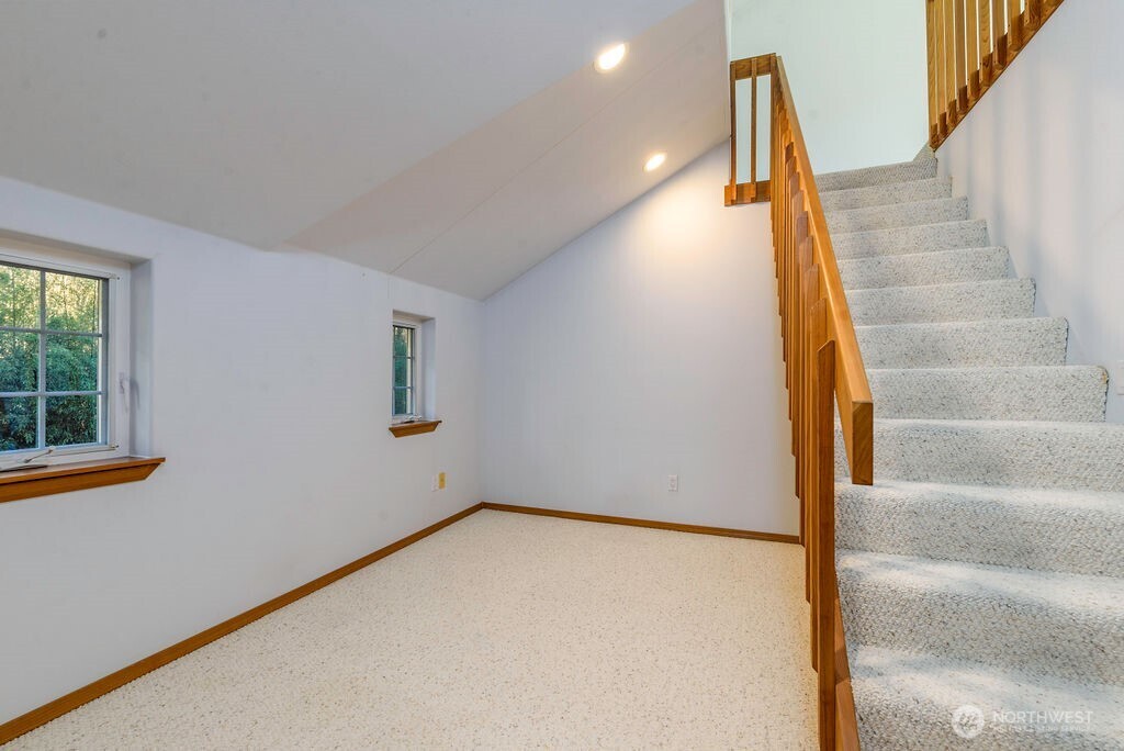 3250 Highway 302 Belfair, WA 98528 - Photo 27 of 40 a view of an empty room with stairs