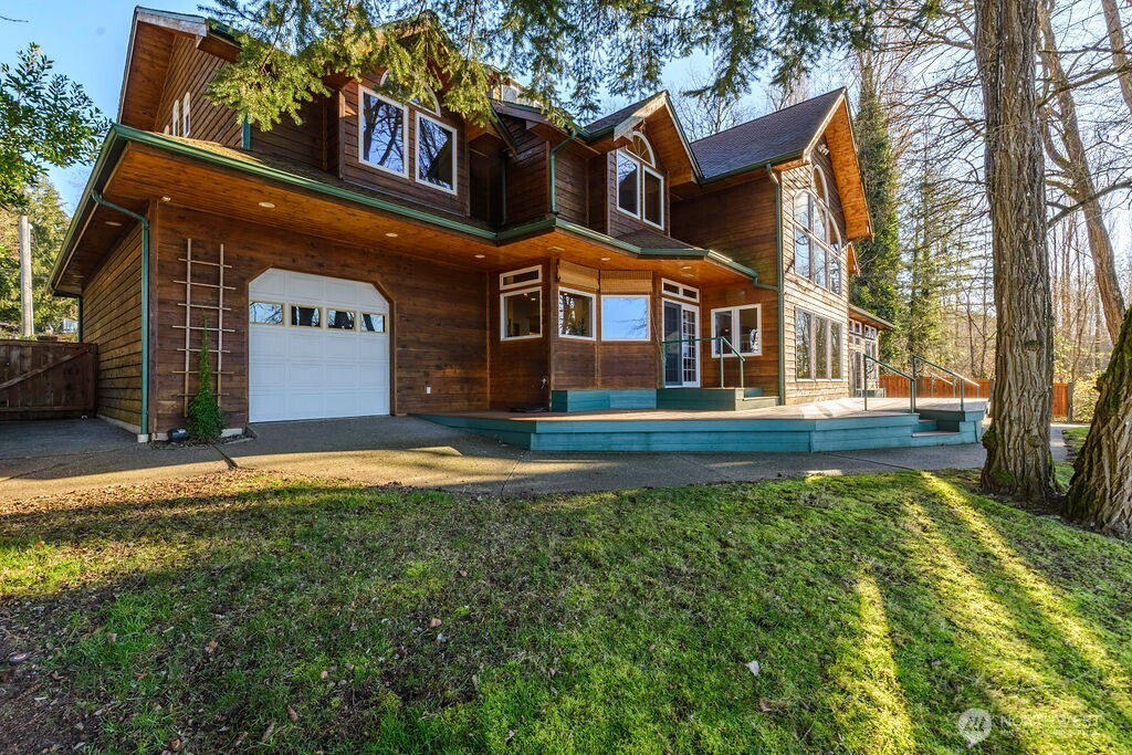 3250 Highway 302 Belfair, WA 98528 - Photo 36 of 40 a front view of a house with a yard