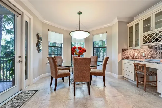 a dining room with furniture window and outside view