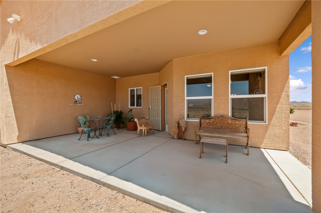 10809 North Jemez Road Kingman, AZ 86401 - Photo 19 of 51 Expansive covered patio featuring a concrete surface, recessed lighting, and multiple windows