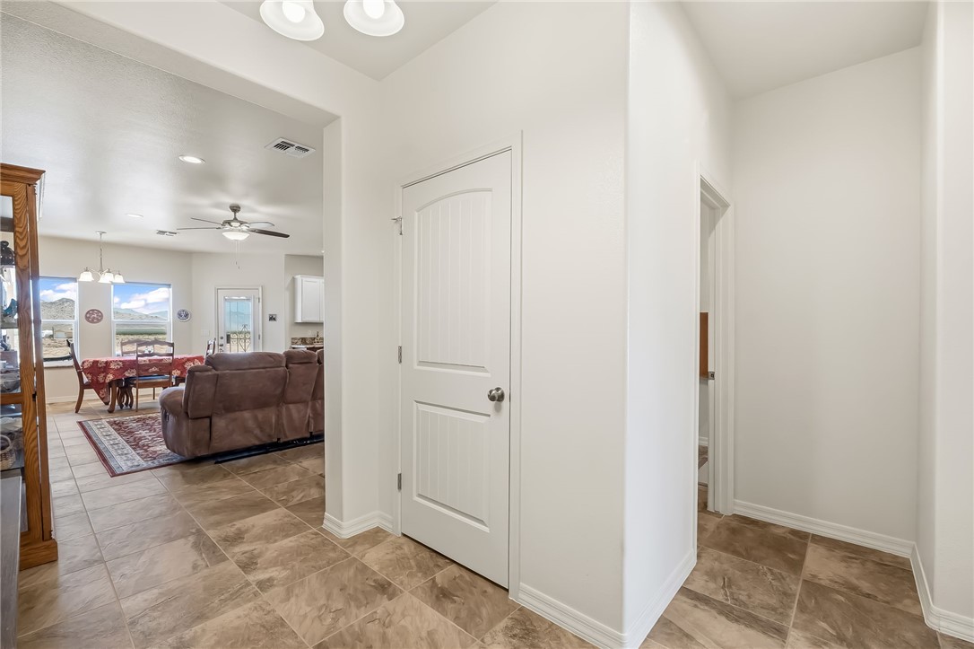 10809 North Jemez Road Kingman, AZ 86401 - Photo 23 of 51 Foyer featuring durable tile flooring, crisp white walls, and a recessed ceiling light fixture