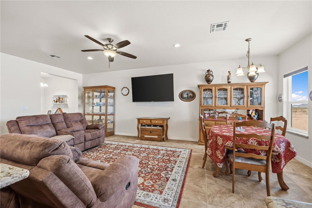 10809 North Jemez Road Kingman, AZ 86401 - Photo 31 of 51 Open-concept living area with neutral wall tones and tile flooring